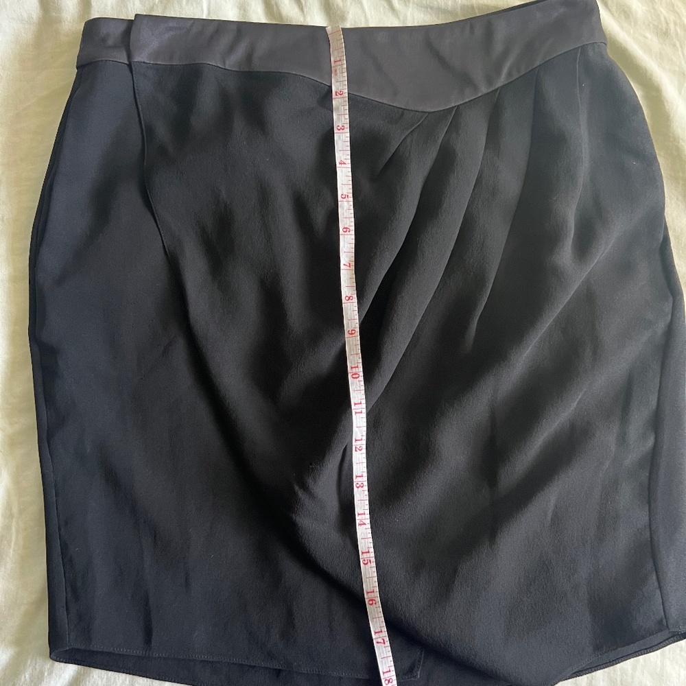 100% silk wrap skirt with pockets, pleats, and a tulip hem